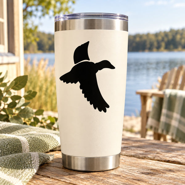 Duck vinyl decal featuring black flying duck silhouette on light surface