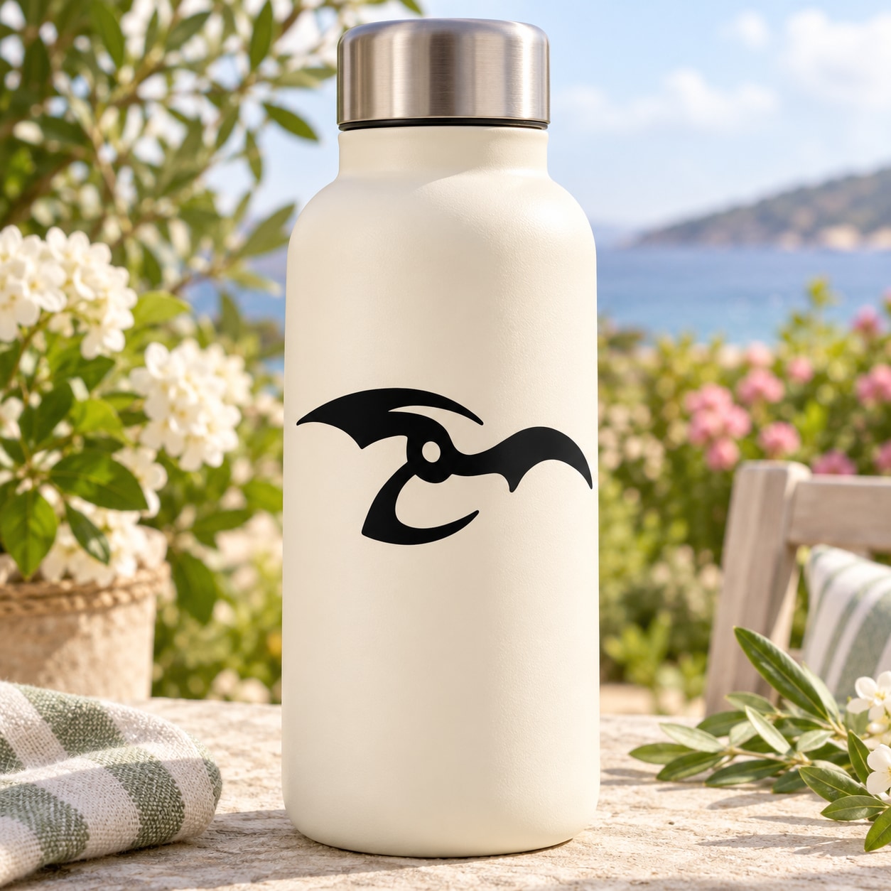 Bird decal graphic on front of light-colored bottle with black beak wings design