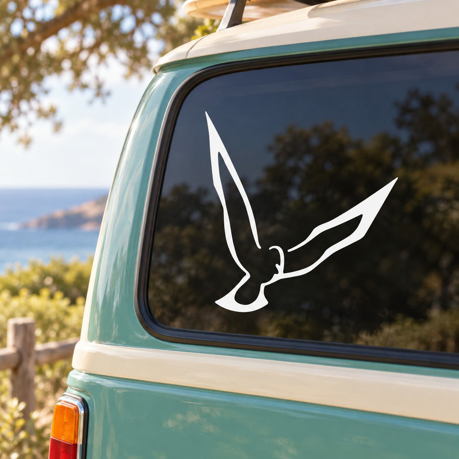 White dove silhouette decal on car window