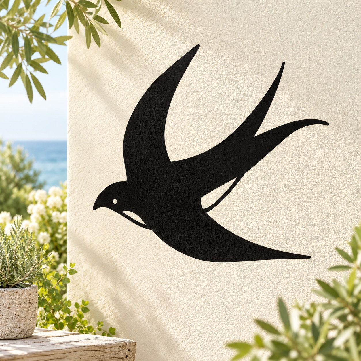 Black flying swallow decal with open wings and tail silhouette