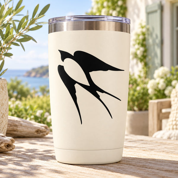 White tumbler with black swallow decal
