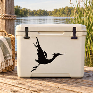 Black stork gliding decal with wings outstretched on white backing