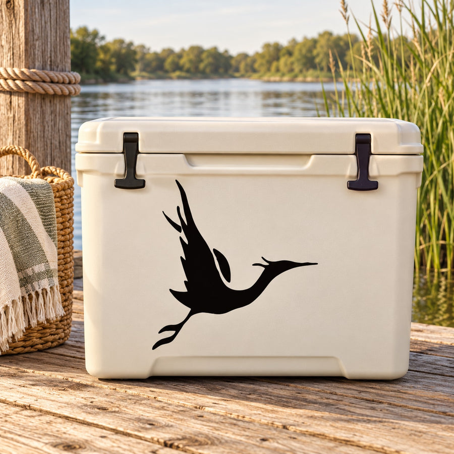 Black stork gliding decal with wings outstretched on white backing