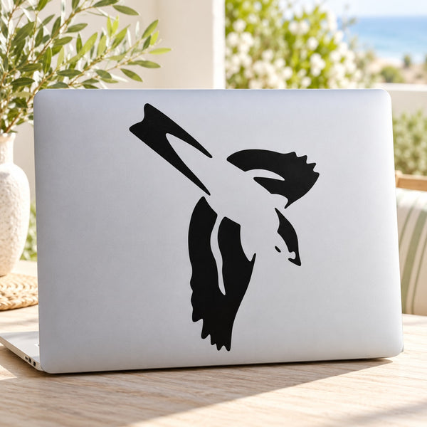 Diving swallow decal with black diving bird silhouette on a light surface