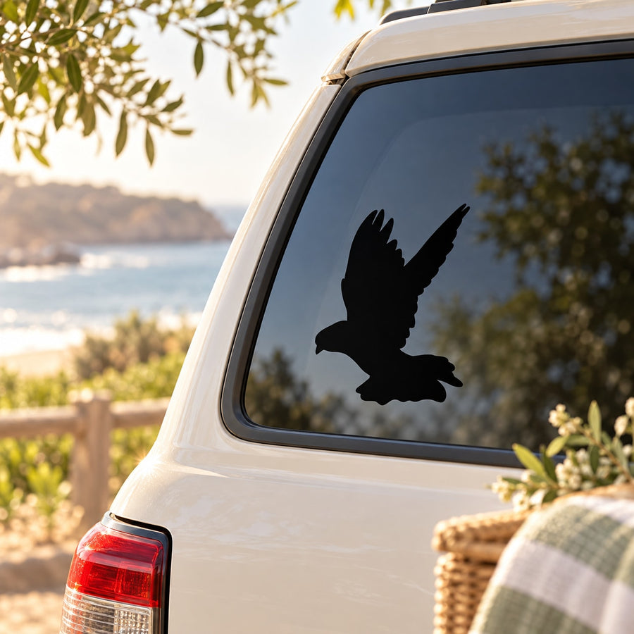 Black dove in flight silhouette decal on car rear window