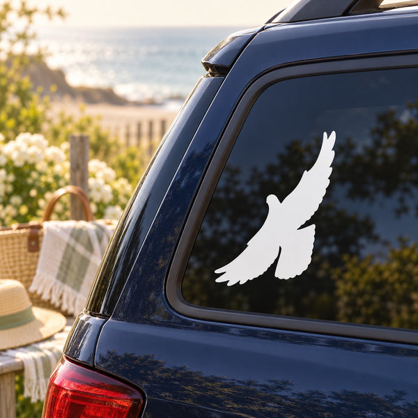 White dove silhouette decal on car rear window