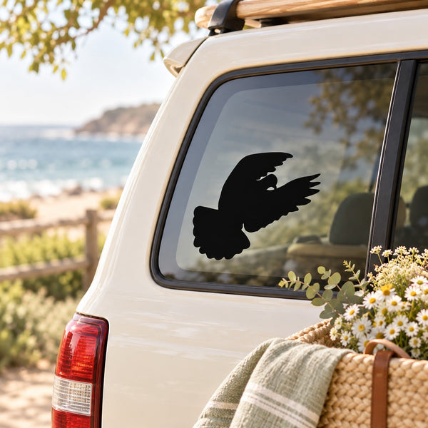 Black dove silhouette decal on a car window