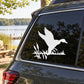 White duck silhouette vinyl decal with reeds, placed on a car rear window.