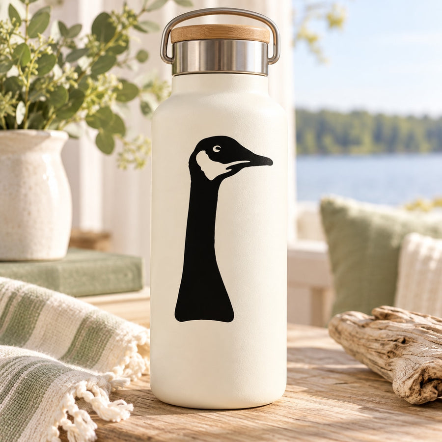 Goose head decal on white bottle, black silhouette of a goose.
