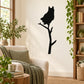 Black owl silhouette wall decal perched on a branch