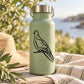 Perched dove decal in black on sage green bottle