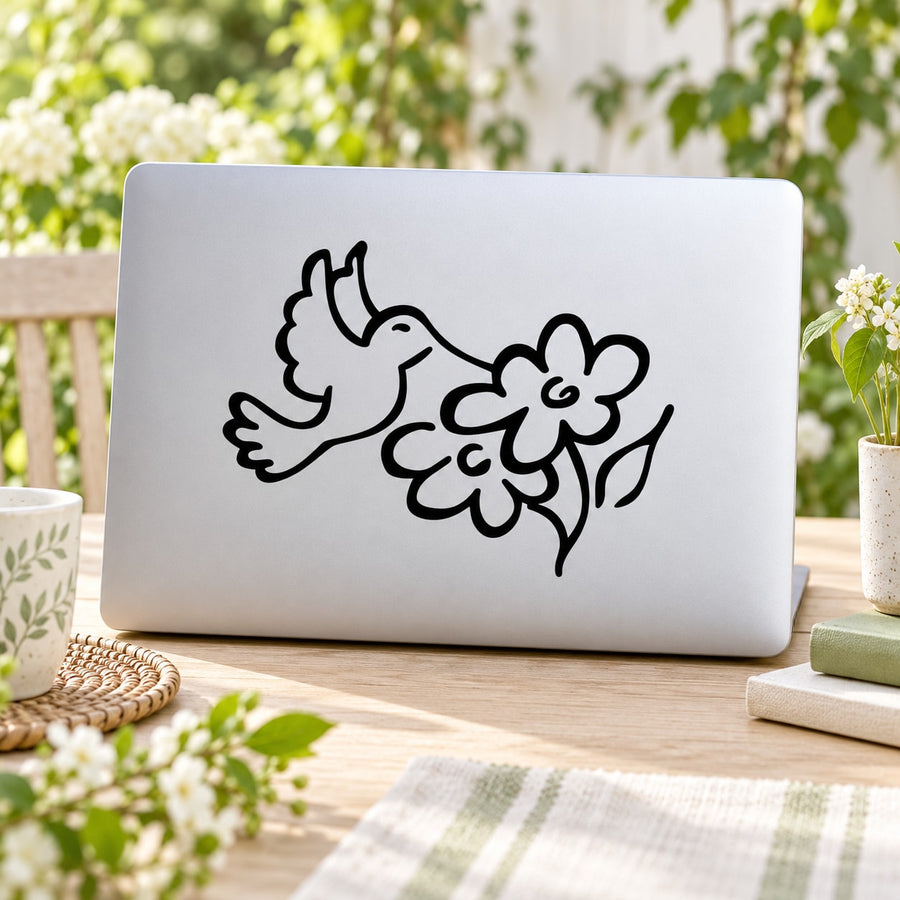 Hummingbird and flower vinyl decal with black line-art on white surface