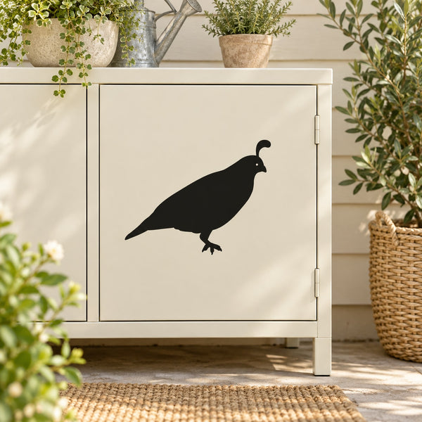 Black quail bird wall decal with stooping pose on light cabinet door