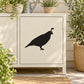 Black quail bird wall decal with stooping pose on light cabinet door