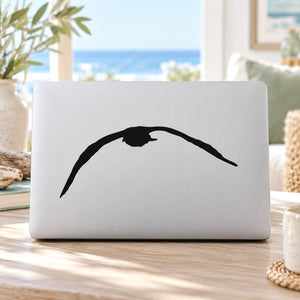 Seagull downward flap decal, bold black silhouette on white surface