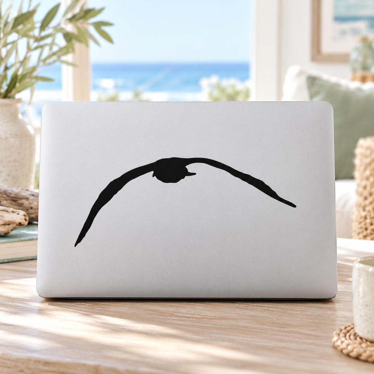 Seagull downward flap decal, bold black silhouette on white surface