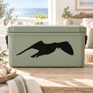 Black flapping seagull decal on light green rectangular cooler surface