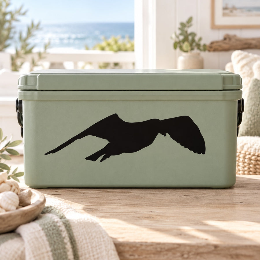Black flapping seagull decal on light green rectangular cooler surface