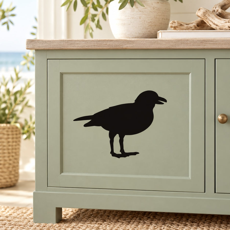 Bird looking decal with black silhouette, simple outline for smooth surface