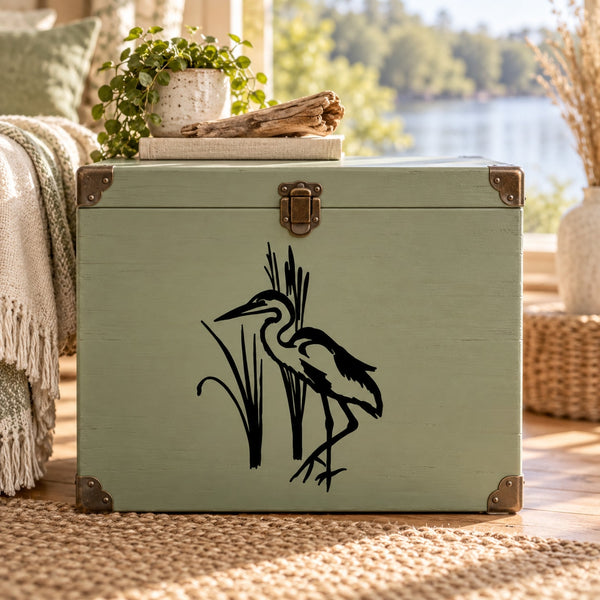 Black whooping crane silhouette with marsh reeds decal on a green surface