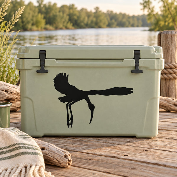 Black flying stork silhouette decal on a light-colored cooler lid