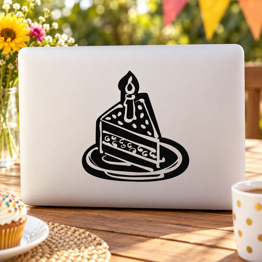 Birthday cake decal with black illustrated layer cake and candle on white surface