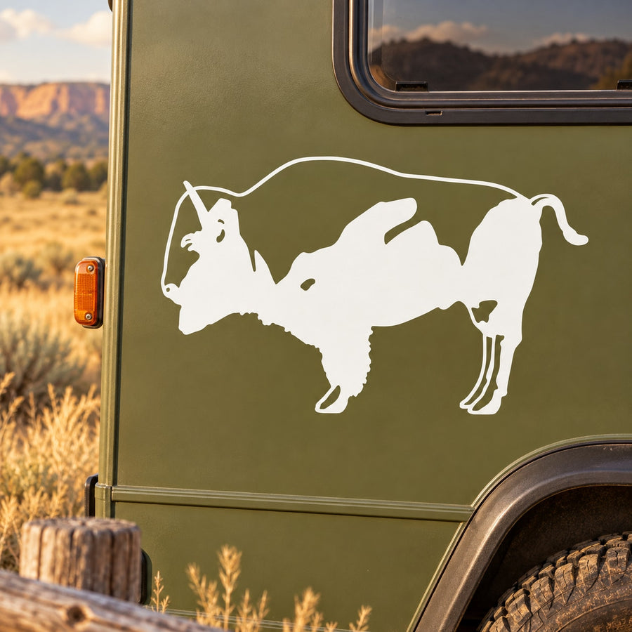 White buffalo silhouette decal on dark green vehicle surface