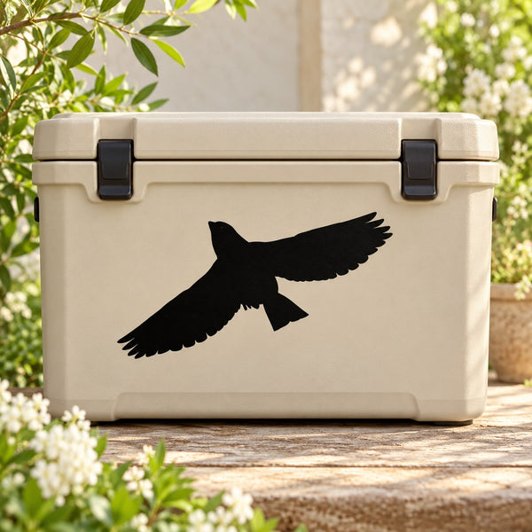 Black flying bird decal on beige storage bin