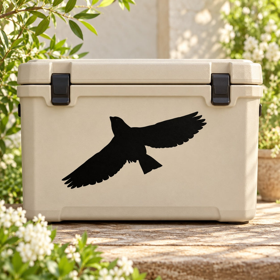 Black flying bird decal on beige storage bin