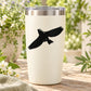 Black bird flying upward vinyl decal on cream tumbler