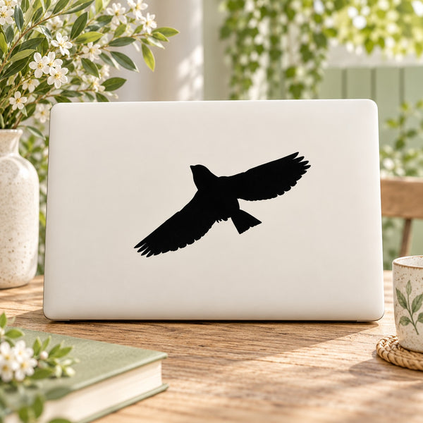 Bird soaring vinyl decal, black silhouette on white background