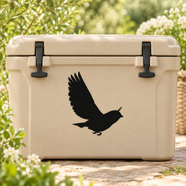 Black bird fluttering decal on a cream cooler