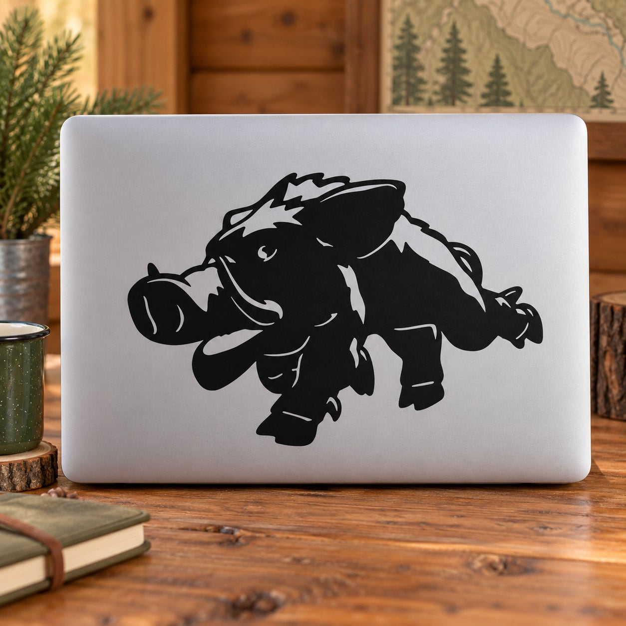 Smiling boar black line-art decal on light laptop lid