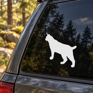 White bobcat silhouette decal on car window