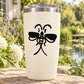 White tumbler with black bow-like split-tail decal
