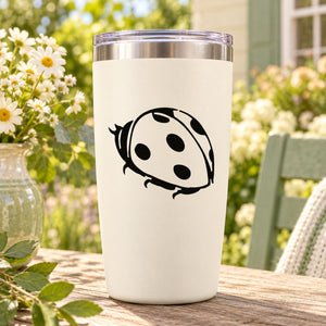 White tumbler with black ladybug decal