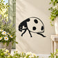 Black walking ladybug decal with white spots and antennae