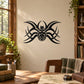 Black tribal spider wall decal with stylized eight legs and central body
