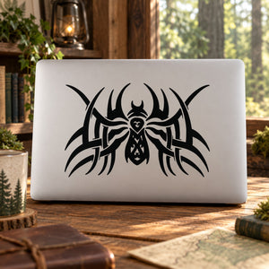 Black tribal spider web decal with stylized spider icon on a light surface
