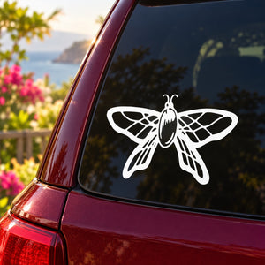 White butterfly vinyl car decal on window glass