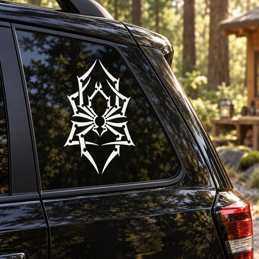 Geometric pointy spider decal with white spider emblem on dark car window