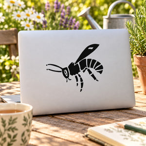 Floating bee decal: black bee graphic with detailed wings on a light surface