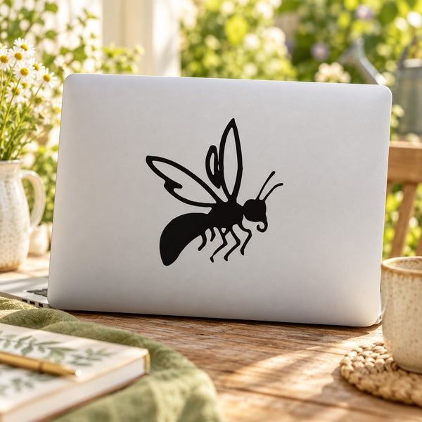 Bee decal with black flying bee silhouette and detailed wings on a light surface