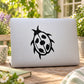 Black animal face decal sticker on light gray laptop lid