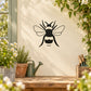 Bee decal wall sticker with suspended black bee silhouette, wings and stripes
