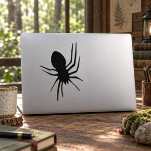 Black spider silhouette decal with long legs on a light surface