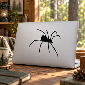 Creeping spider decal, black spider graphic on a light laptop lid