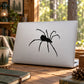 Creeping spider decal, black spider graphic on a light laptop lid
