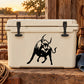 Turning bull decal with black charging bull graphic on white surface