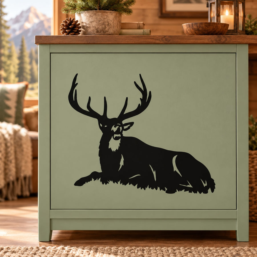 Resting bull elk meadow decal, dark silhouette on light background